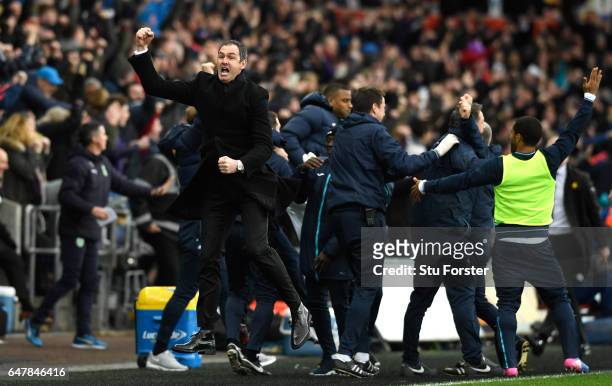 Paul Clement, Manager of Swansea City celebrates his sides third goal during the Premier League match between Swansea City and Burnley at Liberty...
