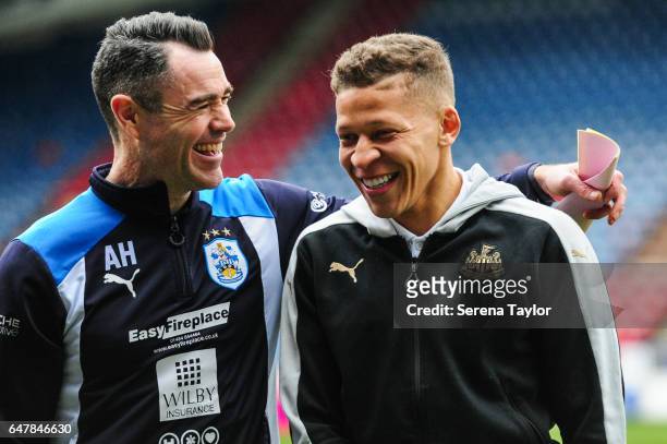 Dwight Gale of Newcastle United shares a joke with Huddersfield First Team Coach Andy Hughes prior to kick off of the Sky Bet Championship Match...