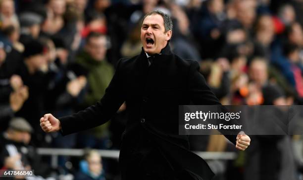 Paul Clement, Manager of Swansea City celebrates his sides third goal during the Premier League match between Swansea City and Burnley at Liberty...