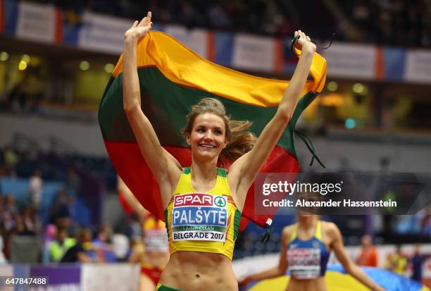 Airine Palsyte of Lithuania celebrates after winng the gold medal during the Women's High Jump final on day two of the 2017 European Athletics Indoor...