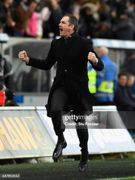 Swansea manager Paul Clement celebrates the winning goal by running down the touchline during the Premier League match between Swansea City and...