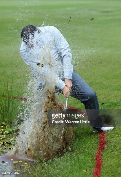 Duncan Stewart of Scotland plays out of the water on the third hole during the third round of the Tshwane Open at Pretoria Country Club on March 4,...