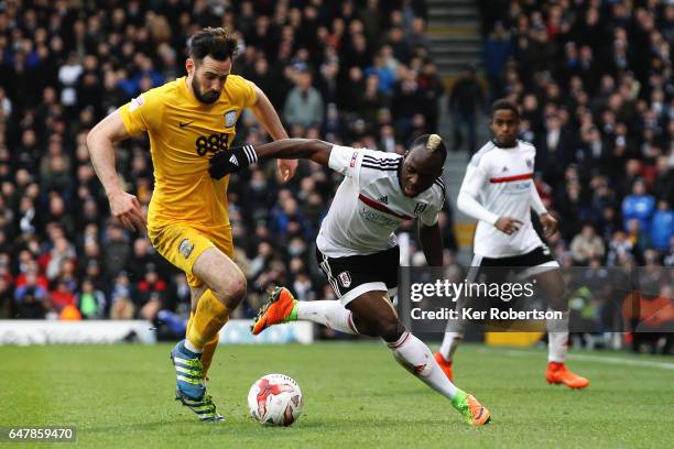 Greg Cunningham of Preston North End and Neeskens Kebano of Fulham challenge for the ball during the Sky Bet Championship match between Fulham and...