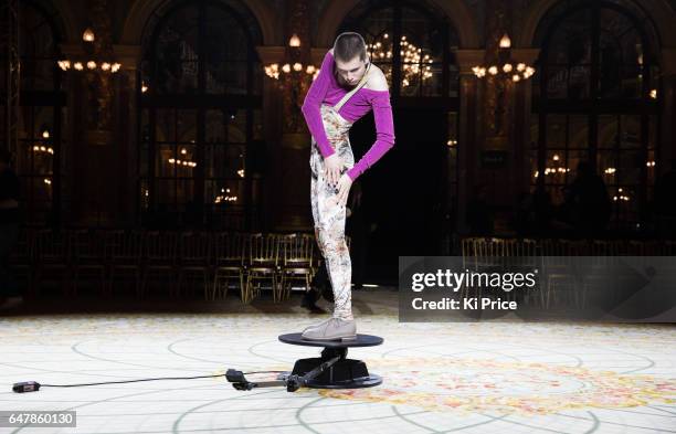 Model poses on the runway for social media before the Vivienne Westwood show as part of the Paris Fashion Week Womenswear Fall/Winter 2017/2018 on...