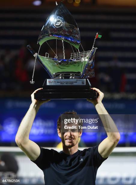 Andy Murray of Great Britain poses with the trophy after winning the final match against Fernando Verdasco of Spain on day seven of the ATP Dubai...