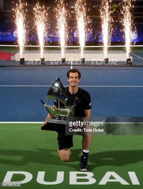 Andy Murray of Great Britain poses with the trophy after winning the final match against Fernando Verdasco of Spain on day seven of the ATP Dubai...
