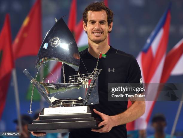 Andy Murray of Great Britain poses with the trophy after winning the final match against Fernando Verdasco of Spain on day seven of the ATP Dubai...