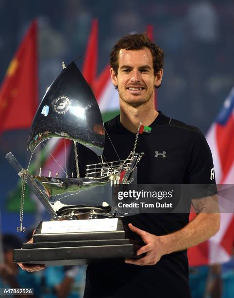 Andy Murray of Great Britain poses with the trophy after winning the final match against Fernando Verdasco of Spain on day seven of the ATP Dubai...