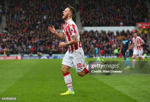 Marko Arnautovic of Stoke City celebrates scoring his sides first goal during the Premier League match between Stoke City and Middlesbrough at Bet365...