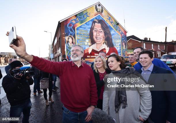 Sinn Fein President Gerry Adams , southern leader Mary Lou McDonald and northern leader Michelle O'Neill take a selfie in front of the Bobby Sands...
