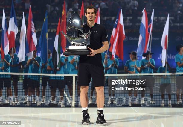 Andy Murray of Great Britain poses with the trophy after winning the final match against Fernando Verdasco of Spain on day seven of the ATP Dubai...