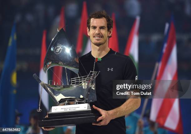 Andy Murray of Great Britain poses with the trophy after winning the final match against Fernando Verdasco of Spain on day seven of the ATP Dubai...