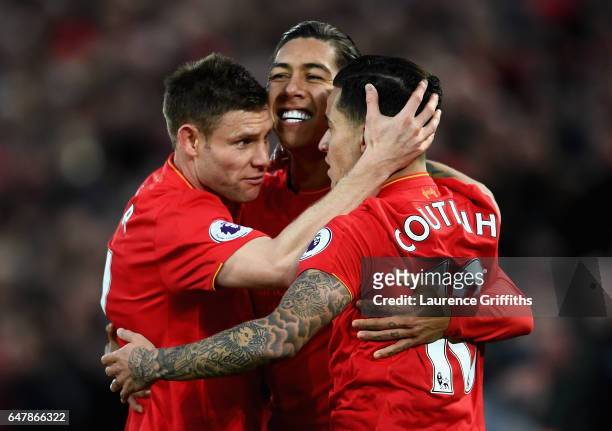 Roberto Firmino of Liverpool celebrates scoring his sides first goal with James Milner of Liverpool and Philippe Coutinho of Liverpool during the...