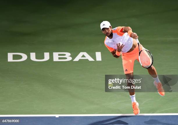 Fernando Verdasco of Spain serves during his final match against Andy Murray of Great Britain on day seven of the ATP Dubai Duty Free Tennis...