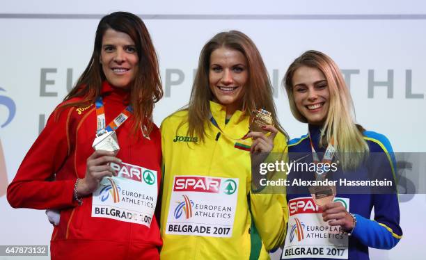 Silver medalist Ruth Beitia of Spain, gold medalist Airine Palsyte of Lithuania and bronze medalist Yuliya Levchenko of Ukraine pose during the medal...