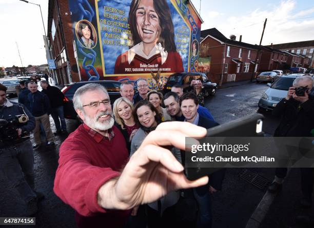 Sinn Fein President Gerry Adams , southern leader Mary Lou McDonald and northern leader Michelle O'Neill take a selfie in front of the Bobby Sands...