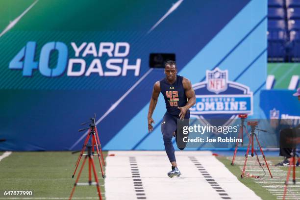 Wide receiver John Ross of Washington runs the 40-yard dash in an unofficial record time of 4.22 seconds during day four of the NFL Combine at Lucas...