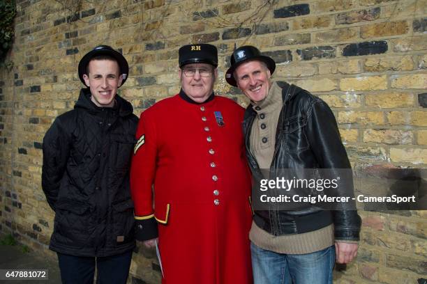 Preston North End fans dressed up for Gentry Day pose with a Chelsea pensioner during the Sky Bet Championship match between Fulham and Preston North...