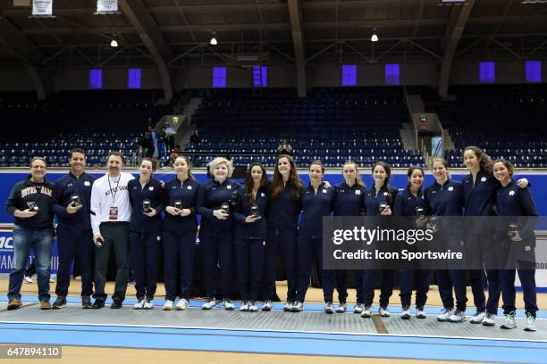 Notre Dame's coaches and players pose with their individual awards after winning the Women's Team championship. From left: assistant coaches Buckie...