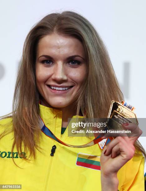 Gold medalist Airine Palsyte of Lithuania poses during the medal ceremony for the Women's High Jump on day two of the 2017 European Athletics Indoor...