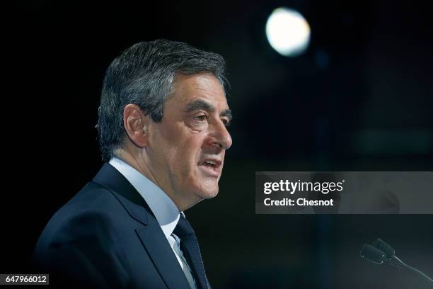 French presidential election candidate for the right-wing "Les Republicains" party Francois Fillon delivers a speech to present his program during a...