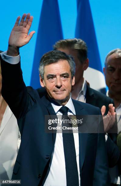 French presidential election candidate for the right-wing "Les Republicains" party Francois Fillon acknowledges the public after a campaign rally to...