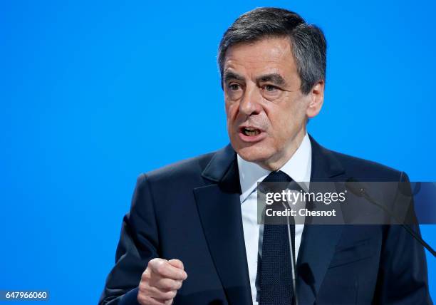 French presidential election candidate for the right-wing "Les Republicains" party Francois Fillon delivers a speech to present his program during a...