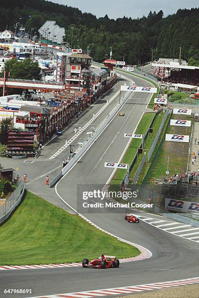 Mika Salo of Finland drives the Scuderia Ferrari Marlboro Ferrari F399 Ferrari V10 ahead of his team mate Eddie Irvine during the Belgian Grand Prix...