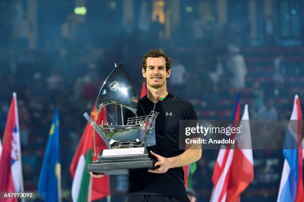 Andy Murray of Great Britain poses with the trophy after winning the final match against Fernando Verdasco of Spain on day seven of the ATP Dubai...