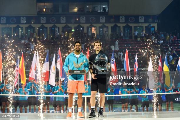 Winner Andy Murray of Great Britain and runner up Fernando Verdasco of Spain pose with the trophies after their final match on day seven of the ATP...