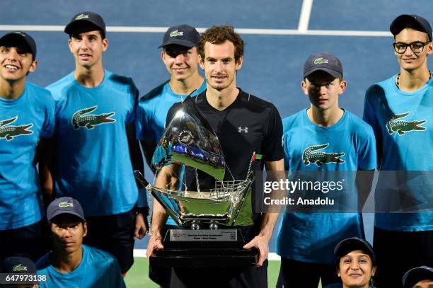 Andy Murray of Great Britain poses with the trophy after winning the final match against Fernando Verdasco of Spain on day seven of the ATP Dubai...