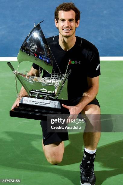Andy Murray of Great Britain poses with the trophy after winning the final match against Fernando Verdasco of Spain on day seven of the ATP Dubai...
