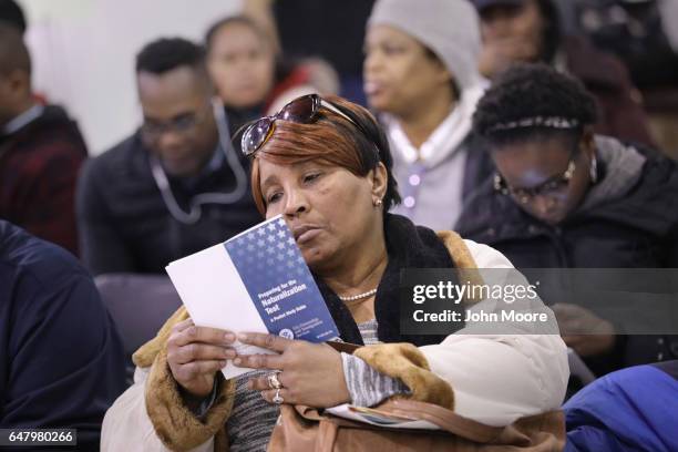 An immigrant wait to receive assistance to complete her U.S. Citizenship application at a CUNY Citizenship Now! event held in the Bronx on March 4,...