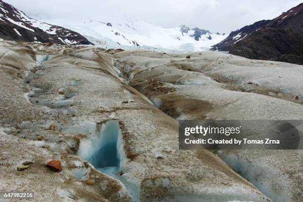 crossing the túnel glacier - crevasse stock pictures, royalty-free photos & images