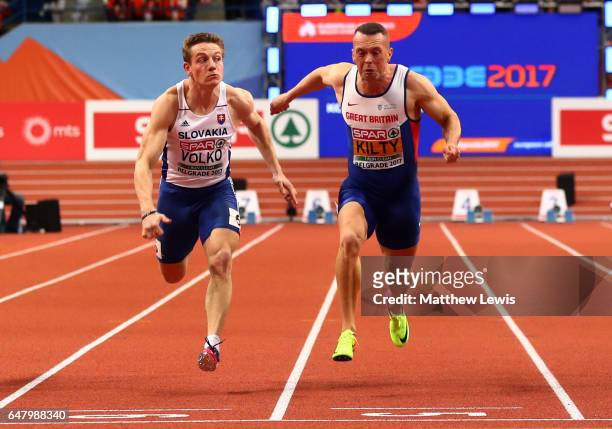 Richard Kilty of Great Britain crosses the finish line ahead of Jan Volko of Slovakia to win the gold medal on day two of the 2017 European Athletics...