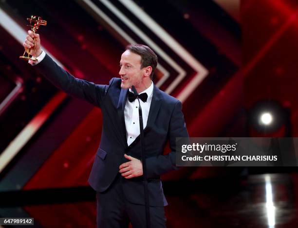 German actor Wotan Wilke Moehring receives the Golden Camera award for Best German actor in Hamburg, northern Germany on March 4, 2017. / AFP PHOTO /...