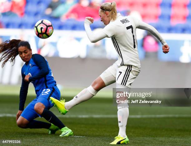 Pauline Bremer of Germany clears the ball in front of Amel Majri of France during their match at Red Bull Arena on March 4, 2017 in Harrison, New...
