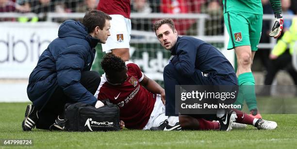 Gabriel Zakuani of Northampton Town recieves treatment after colliding with team mate Adam Smith causing Zakuani a leg injury which he had to leave...