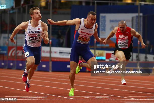 Richard Kilty of Great Britain crosses the finish line ahead of Jan Volko of Slovakia to win the gold medal on day two of the 2017 European Athletics...