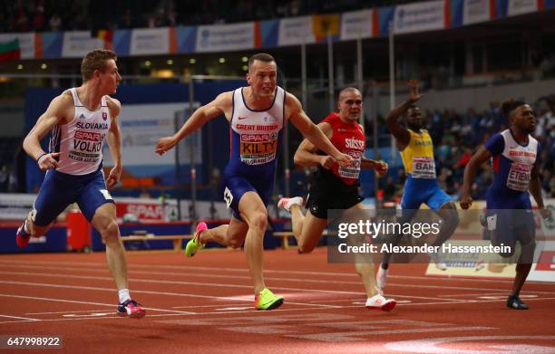 Richard Kilty of Great Britain crosses the finish line ahead of Jan Volko of Slovakia to win the gold medal on day two of the 2017 European Athletics...