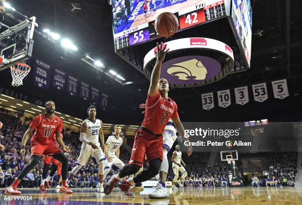 Guard Devon Thomas of the Texas Tech Red Raiders reaches for a loose ball against the Kansas State Wildcats during the second half on March 4, 2017...