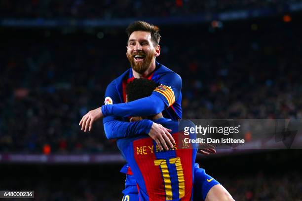 Neymar of Barcelona celebrates with Lionel Messi after scoring their second goal during the La Liga match between FC Barcelona and RC Celta de Vigo...
