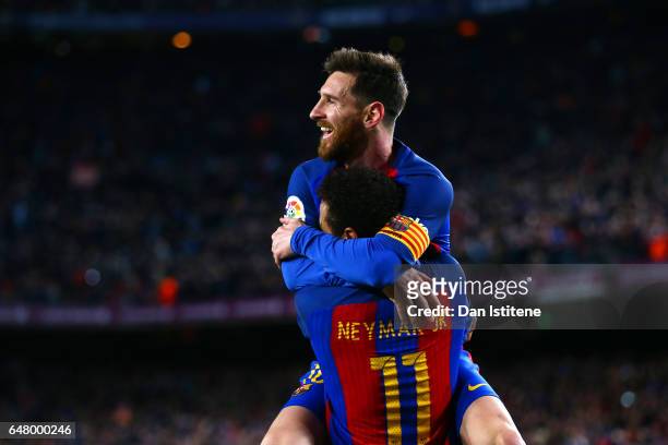 Neymar of Barcelona celebrates with Lionel Messi after scoring their second goal during the La Liga match between FC Barcelona and RC Celta de Vigo...