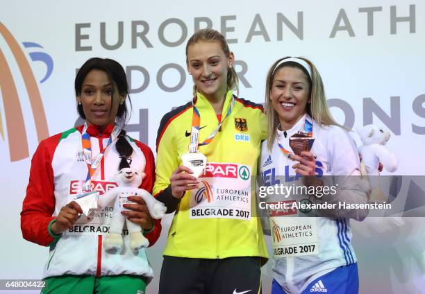 Silver medalist Patricia Mamona of Portugal, gold medalist Kristin Gierisch of Germany and bronze medalist Paraskevi Papahristou of Greece pose...
