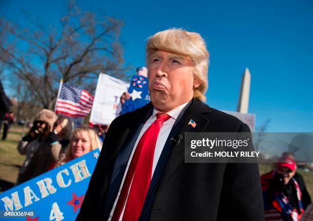 Political impersonator Dustin Gold, marches as Donald Trump outside the White House during a pro-Trump rally on March 4 in Washington, DC.