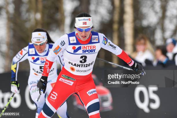Marit Bjoergen from Norway and Charlotte Calla from Sweden, during Ladies cross-country 30 km Mass Start Free final, at FIS Nordic World Ski...