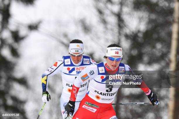 Charlotte Calla from Sweden behind Marit Bjoergen from Norway during Ladies cross-country 30 km Mass Start Free final, at FIS Nordic World Ski...