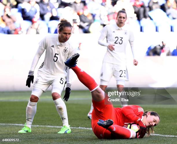 Laura Benkarth of Germany stops a shot as teammate Babett Peter looks on during the second half against France during the SheBelieves Cup at Red Bull...