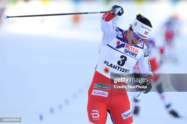 Marit Bjoergen celebrates after she wins her Fourth Gold Medal ahead of her Norway team-mates, Heidi Weng, Astrid Uhrenholdt Jacobsen and Ragnhild...