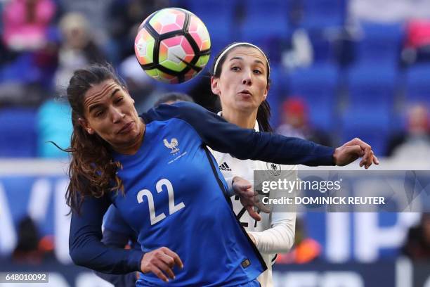 France's Amel Majri and Germany's Sara Doorsoun watch the ball as the France and Germany women's national teams play in the SheBelieves Cup in...